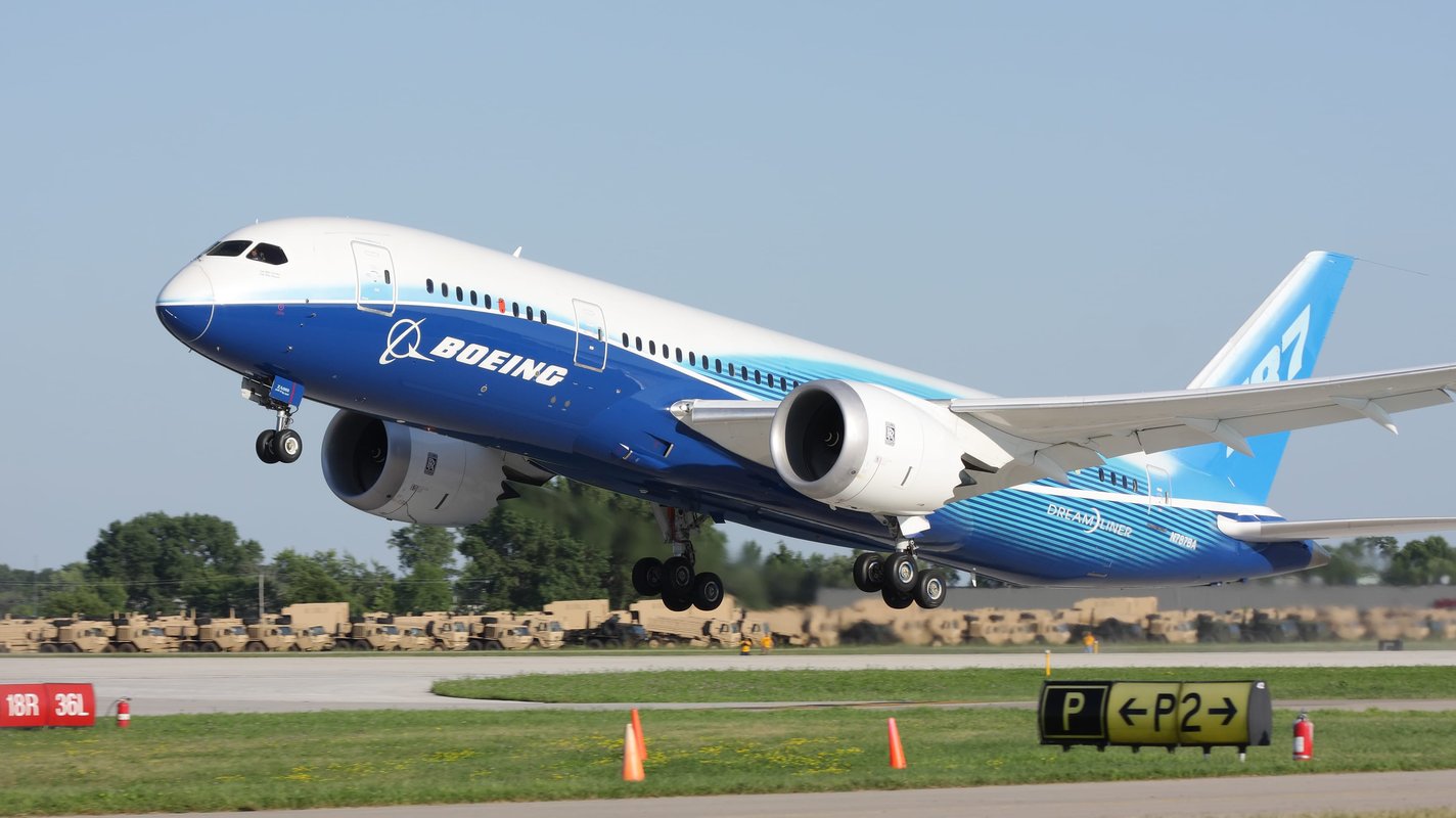 On an airport, an airplane manufactured by BOEING CO is ready to take off.
