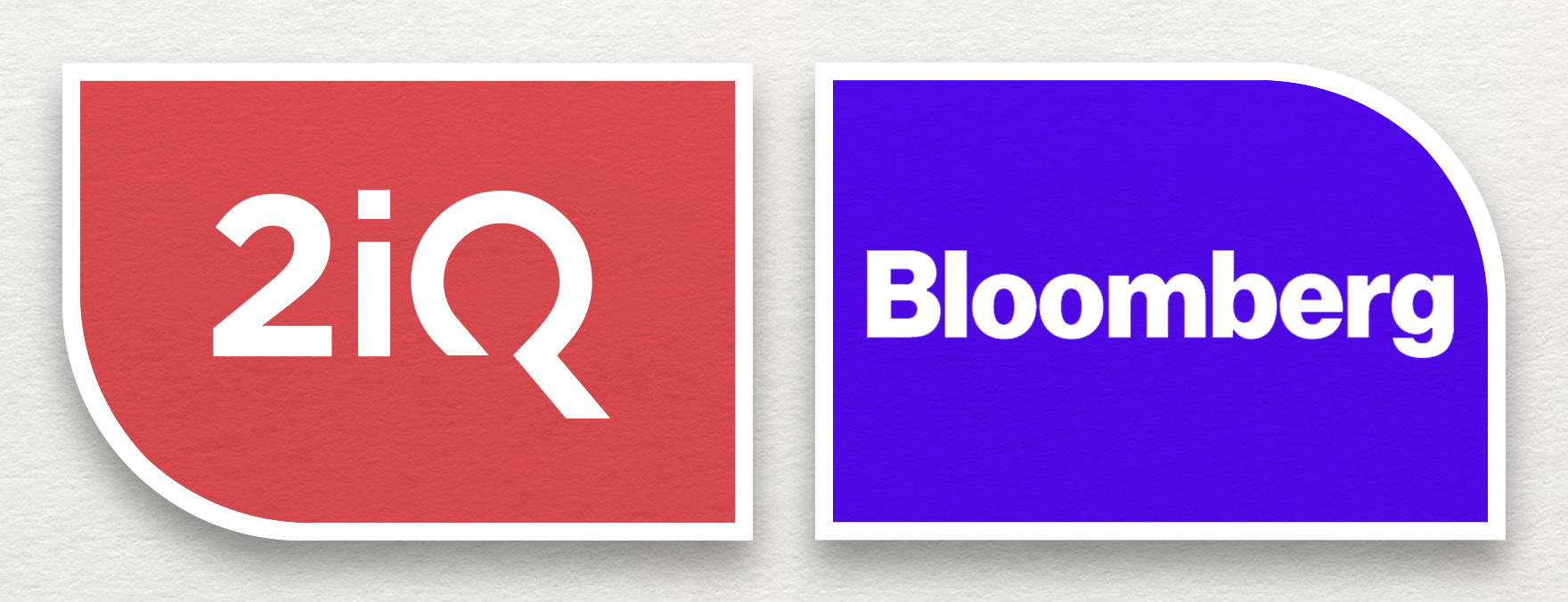 The Bloomberg logo in white and purple is on the right, while the 2iQ Research logo in red and white is on the left, both placed on grey background.