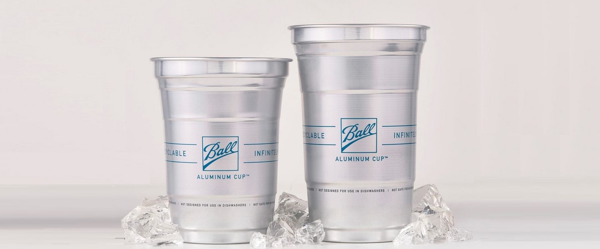 Two silver-colored glasses with the Ball emblem are set atop ice cubes with the white background