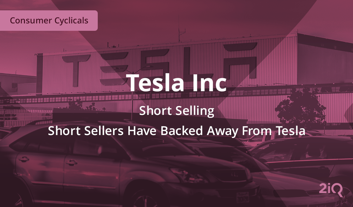 The image's background depicts cars parked in front of the Tesla building, with the blog introduction mentioned that short sellers have backed away from Tesla on top.
