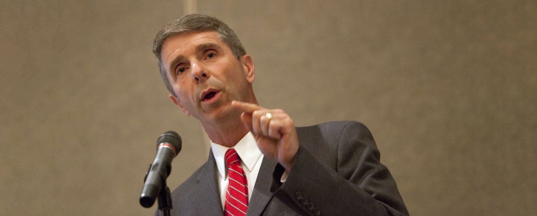 A still of Rep. Rob Wittman speaking at the Chamber of Commerce during a press conference in September 2012